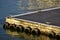 Floating jetty on surface reflecting evening light