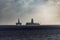 Floating Oil Rigs on Ocean in Sillhouette
