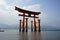 Floating orange shinto shrine of Miyajima in the Hiroshima region, Japan on the Itsakushima island during the sunset