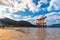 Floating red giant Grand O-Torii gate stands in Miyajima island bay beach