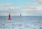 Floating red navigational buoy on blue sea. Marine signal buoy. Navigational Buoy marking a shipping channel