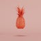 Floating red pineapple made of paper on pastel red background