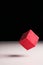 Floating red puzzle cube