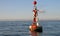 Floating red and white buoy