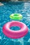 Floating rings on blue water swimpool