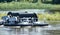 Floating small power plants on the Elbe near Magdeburg, Germany, which generate energy by rotating wheels in the river