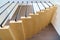 Floating stairs. Wooden steps attached to wall in modern building