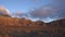 Floating sunset clouds over Casa Winter and Cofete beach in Fuerteventura, Canary Islands