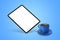 Floating tablet mockup and coffee cup on the blue isolated background