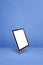 Floating tablet pc computer isolated on blue. Vertical background