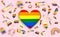 Floating various objects connected with gay pride and in the middle a big heart with rainbow pattern inside. LGBT issues. 3D