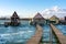 floating village bungalows in Bokod Hungary wit wooden pier walkway