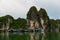 Floating village in Ha Long Bay, Vietnam, with rain in the foreground and mist in the distance