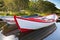 Floating Wooden Boats with Reflection in a Water