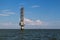 A flock of birds near the lighthouse in the Sea of Azov