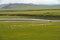 Flock of black sheep grazing on a vast plain in the Orkhon Valley