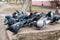 A flock of blue-gray pigeons eats grain on a stone pedestal in the city Park