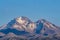 Flock of flying ruddy shelducks with snow-capped mountains background