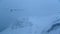 A flock of geese flying in front of the rugged mountains of Iceland