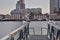 A flock of gulls on the rails of the pier on a cloudy day