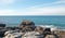 Flock of Pelicans on rock at Cerritos Beach on Punta Lobos in Baja California Mexico