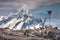 A flock of penguins . Antarctic mountains.