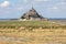A flock of sheep grazing on the salt meadows close to the Mont Saint-Michel
