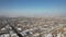 A flock of storks flies over the city in the winter sky In Armenia