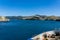 Flocks of seabirds on water below as top of South Island and Marlborough Sounds are approached by sea