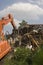 Flood Damaged home being torn down in New Orleans.