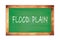 FLOOD  PLAIN text written on green school board