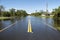 Flooded american street in Florida residential area. Hazardous driving conditions. Consequences of hurricane natural