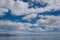 Flooded Bonneville Salt Flats in Utah create a mirror reflection scene on the water, looking surreal