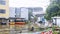 Flooded buildings and buses with a man standing