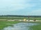 Flooded farmland and equipment in Iowa along interstate 29