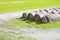 Flooded fields with wet hay bales after torrential rain