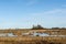 Flooded landscape by an old dry stone wall