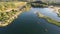 Flooded and overgrown sand quarry. Lush green summer landscape for outdoors vacation, hiking, camping or tourism. Volokolamsk