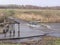 Flooded road dangerous passage through the river in a flood on the destroyed bridge natural disaster in Siberia