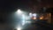 A flooded road with street lights on a misty winters night. With a blurred; bokeh; out of focus edit