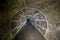 Flooded round sewer tunnel is reflecting in water