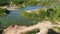 Flooded sand quarry near Sychevo area. Lush green summer landscape for outdoors vacation, hiking, camping or tourism. Volokolamsk