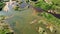 Flooded sand quarry near Sychevo area. Turquoise water pond. Lush green summer landscape for outdoors vacation, swimming.