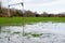 Flooded sports pitch after heavy rain the field is waterlogged