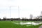 Flooded sports pitch after heavy rain the field is waterlogged