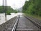 The Flooded Straight Railway Track with Timber Sleepers