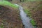 Flooded stream led to a narrow riverbed where the water drains quickly, the bends must be laid out with a stone so that water eros