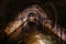 Flooded vaulted sewer tunnel with water reflection