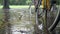 Flooding Cataclysm in Thailand. Bicycles Standing in Deep Water Puddle. Heavy Rain Season after Climate Changing in Asia