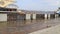 Flooding in city, high water level. Water spills along embankment, pier with boat. City Dnipro, Ukraine